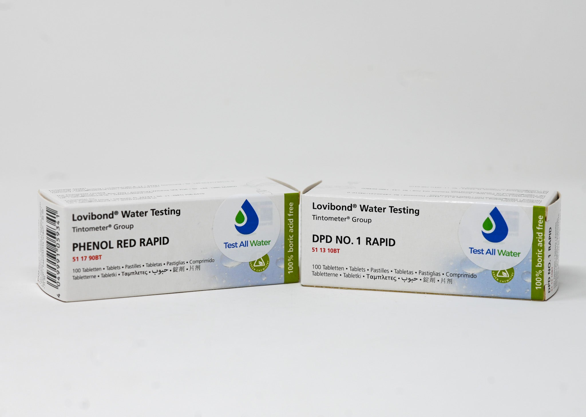 Two boxes of Lovibond Water Testing DPD No. 1 Rapid and Phenol Red Rapid test tablets, each containing 100 test tablets for water testing.